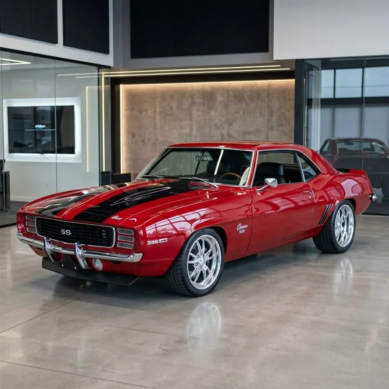 1969 Chevrolet Camaro SS Pro-Touring Build with LS3 V8 engine, custom cherry red paint, in premium showroom